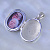 Отрывающийся серебряный медальон с фотографиями родителей внутри и инициалами в виде монограммы (Вес: 8,6 гр.)