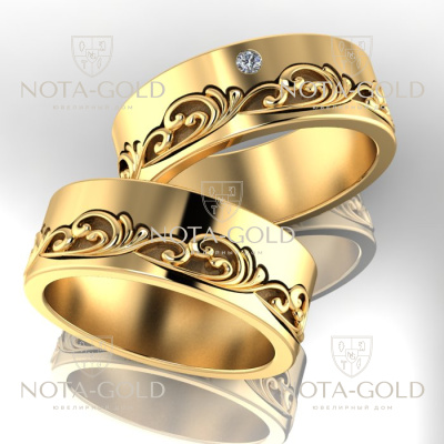 Обручальные кольца из жёлтого золота с вензелями и бриллиантом в женском кольце (Вес пары:17 гр.)