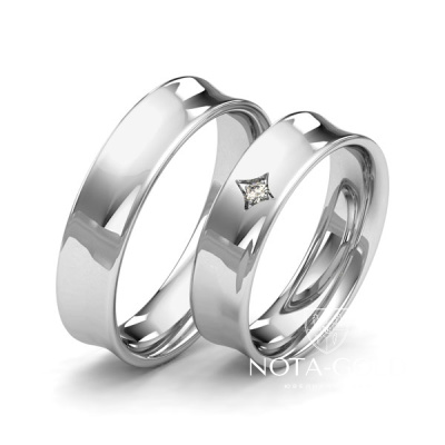 Вогнутые глянцевые платиновые обручальные кольца с бриллиантом в женском кольце (Вес пары: 17 гр.)