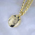 Небольшой медальон с инициалами ФИО из жёлтого золота под фотографию Клиента (Вес: 6 гр.)