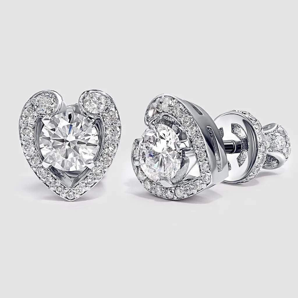 Серьги пусеты из белого золота в виде сердечка с бриллиантами Серьги пусеты из белого золота в виде сердечка с бриллиантами
