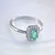 Женское помолвочное кольцо из белого золота с крупным изумрудом 0,5ct и бриллиантами (Вес: 3 гр.)