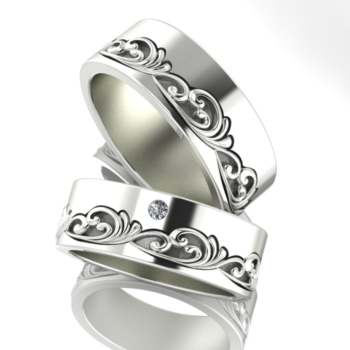 Обручальные кольца из белого золота с вензелями и бриллиантом в женском кольце (Вес пары:17 гр.)