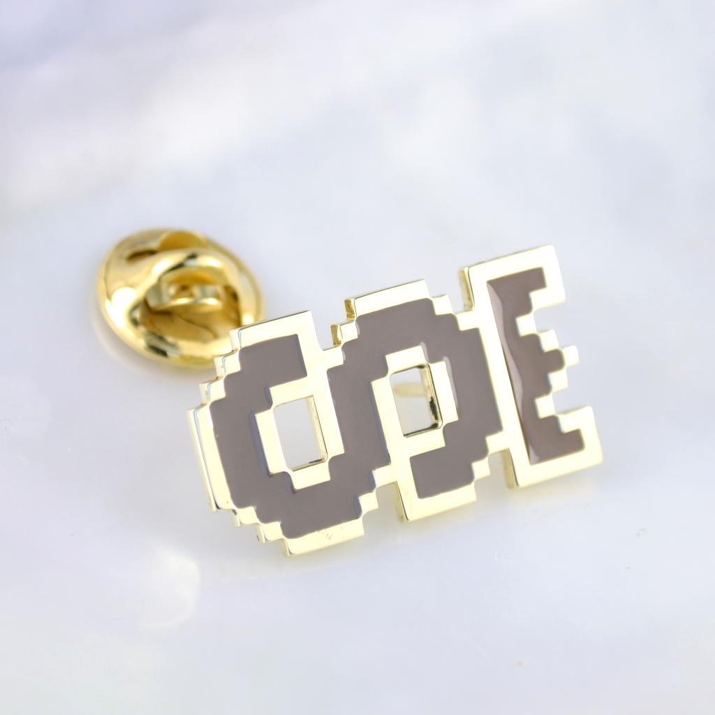 Золотой нагрудный значок с эмалью в виде знака доллара с короной (вес 6 гр.)