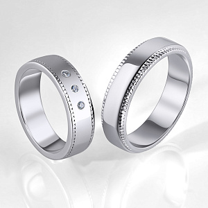 Обручальные кольца из белого золота с тремя бриллиантами в женском кольце (Вес пары 11,5 гр.)