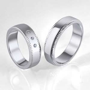 Обручальные кольца из белого золота с тремя бриллиантами в женском кольце (Вес пары 11,5 гр.)