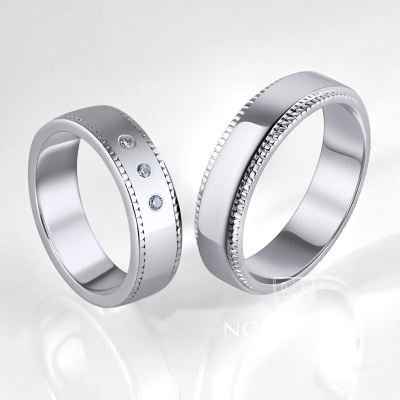 Обручальные кольца из белого золота с тремя бриллиантами в женском кольце (Вес пары 11,5 гр.)