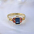 Женское золотое кольцо с натуральными камнями - турмалином и сапфирами (Вес: 4 гр.)