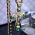 Нательный золотой крест с ликами святых, бриллиантами и изумрудами на золотой цепочке плетение Рыбка (Вес: 43 гр.)