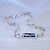 Женский браслет плетение Бесконечность из белого золота с сапфирами клиента на пластине (цена за грамм)