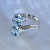 Женское кольцо с голубыми топазами и бриллиантами (Вес: 13 гр.)