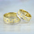 Необычное обручальное кольцо с фактурной поверхностью из золота двух оттенков и бриллиантами (Вес пары: 21 гр.)
