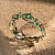 Женское кольцо в виде растительного орнамента из желтого и белого золота с изумрудами (Вес 3,5 гр.)