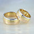 Широкие обручальные кольца из трёх оттенков золота с бриллиантом принцесса в женском кольце (Вес пары: 20 гр.)