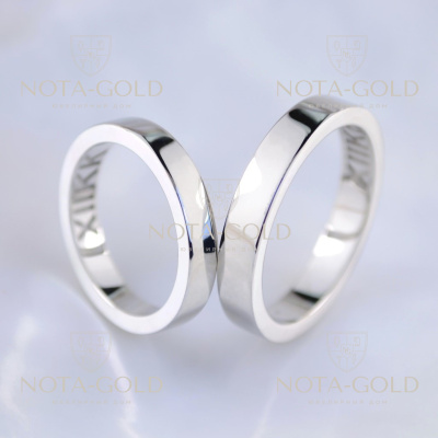 Классические обручальные кольца из белого золота с гравировкой даты свадьбы римскими цифрами (Вес пары: 11 гр.)