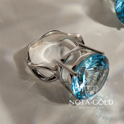 Кольцо из белого золота с топазом огранки круг (Вес: 5,5 гр.)