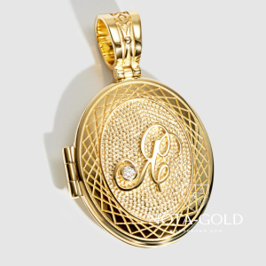 Открывающийся медальон Я и знаком зодиака Дева из желтого золота с бриллиантом (Вес 18 гр.)