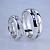 Гладкое обручальное кольцо из белого золота с прорезью в которой закреплены бриллианты (Вес пары: 9 гр.)
