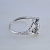 Помолвочное кольцо с ангелами держащими бриллиант 0,065 карат из белого золота (Вес: 2,8 гр.)