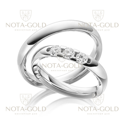 Узкие глянцевые платиновые обручальные кольца с тремя крупными бриллиантами в женском кольце (Вес пары: 16 гр.)