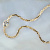 Женская золотая цепочка на тело якорного плетения с подвеской и камнем (цена за грамм)