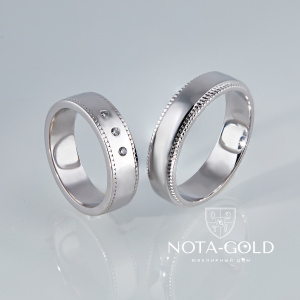 Обручальные кольца из белого золота с тремя бриллиантами в женском кольце (Вес пары 11,5 гр.)