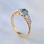 Помолвочное золотое кольцо из красно-белого золота с изумрудом, бриллиантами и рубинами (Вес: 4 гр.)